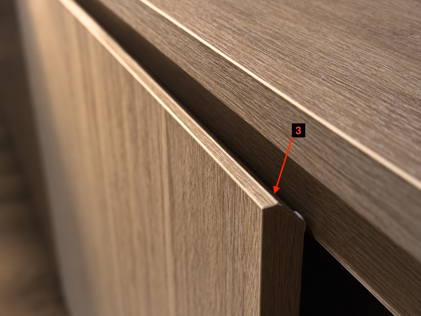 Close-up of the visible dark gap between the cabinet top and the door front.
